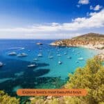 Beautiful turquoise bay with boats discovered during the Ibiza Routeplan driving route