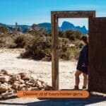 Woman standing in front of magical art on Ibiza explored with the Ibiza Routeplan