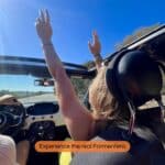 Driving through Formentera in a convertible during a scenic island roadtrip with coastal views.