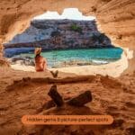 Hidden cove in Formentera with turquoise water viewed from a cave opening, a perfect hidden gem on the island.