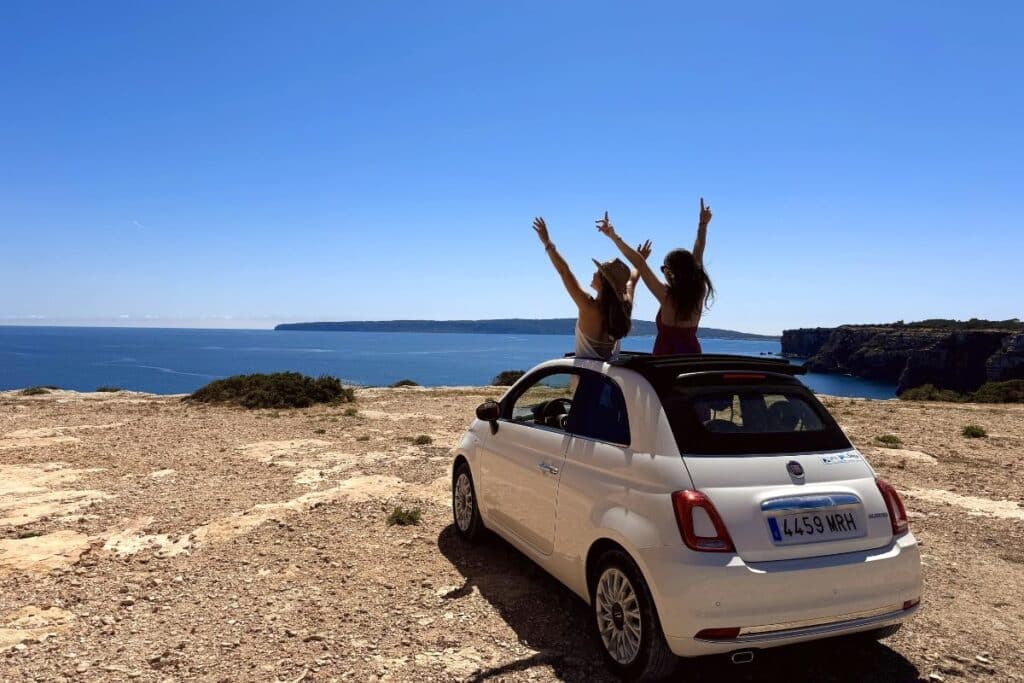 Travelers enjoying a scenic coastal self-drive route in Formentera