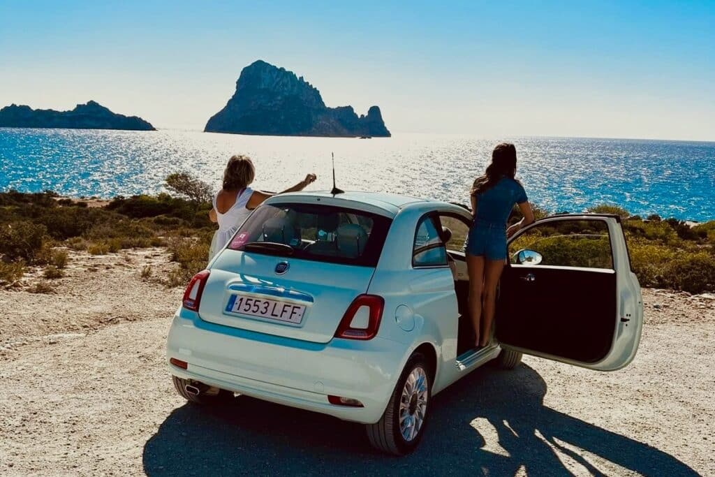 Travelers stopping at Es Vedrà viewpoint during an Ibiza self-drive road trip