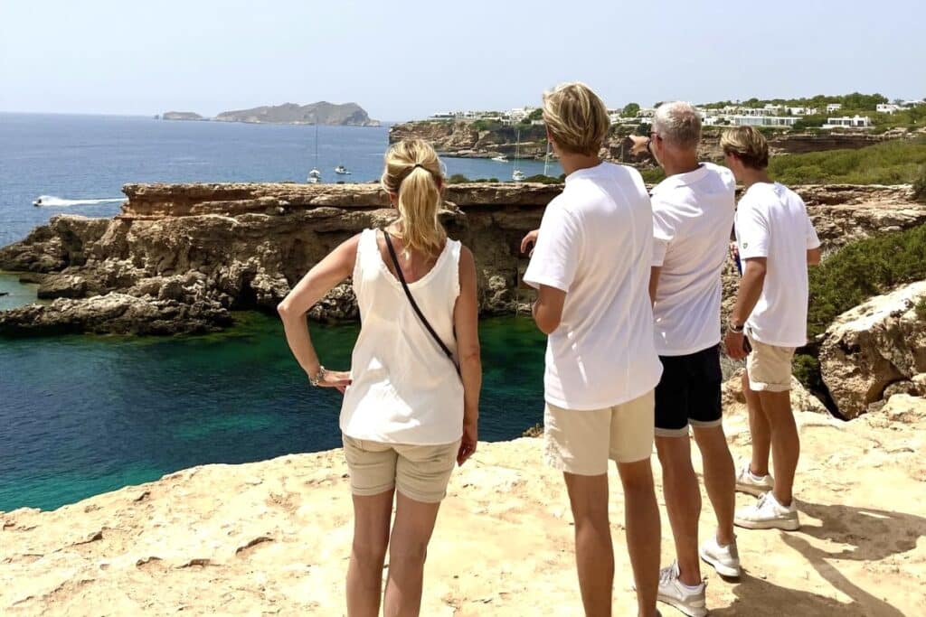 Travelers enjoying scenic coastal cliffs during an Ibiza self-drive route