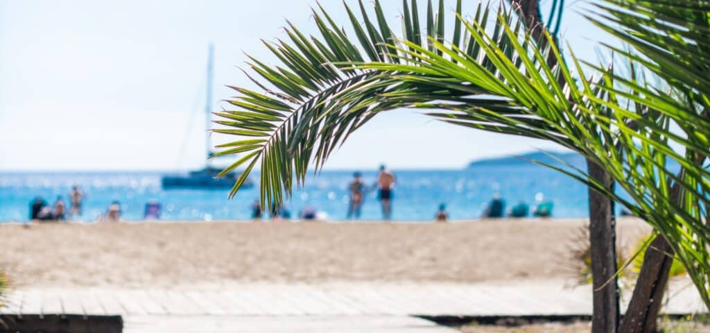 turquoise beach with wooden path in the north of Ibiza